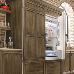 Refrigerator with wood panels to match the surrounding cabinetry