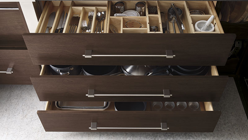 Cabinet drawers opened to show inserts for organization