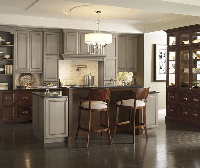 Traditional kitchen with Brookside and Riff Cherry cabinets in Pumice and Chestnut finishes