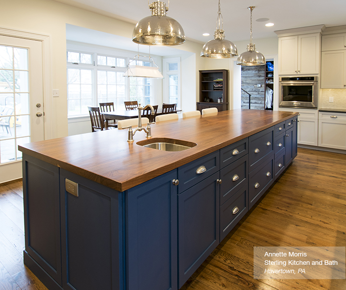 Puritan Off white cabinets in maple magnolia with a blue kitchen island blue lagoon