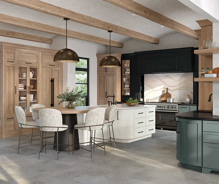 Wide kitchen view featuring Omega quartersawn white oak cabinet doors and Jaxson (formerly Jax) in natural wood tones.